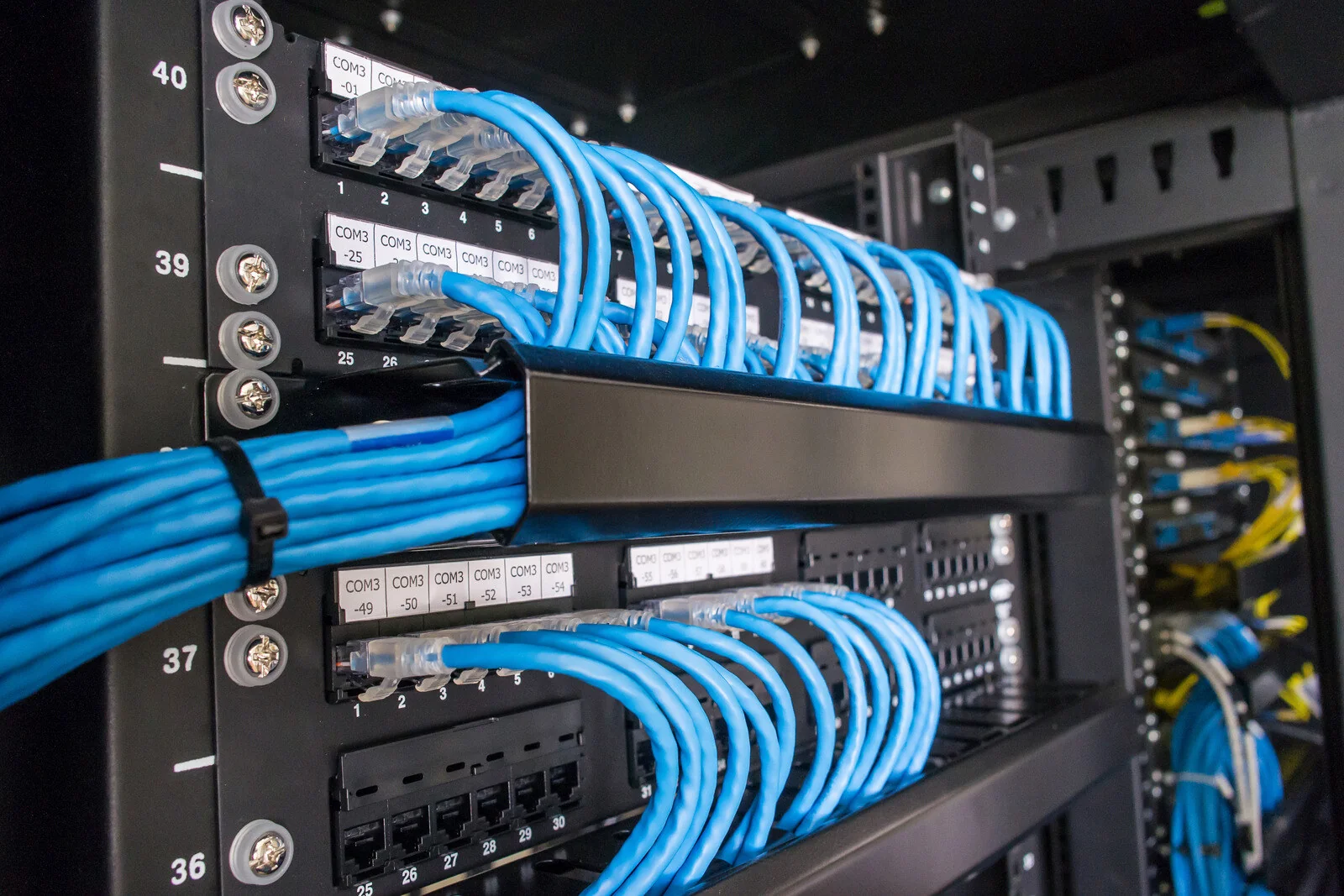 Patch panel with organised network cables ready for deployment